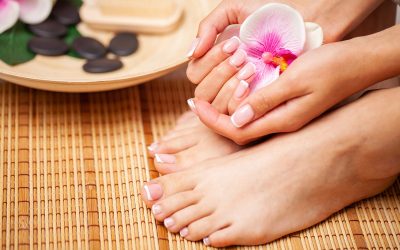 The picture of female legs and hands after pedicure and manicure The picture of female legs and hands after pedicure and manicure